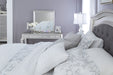 Coralayne Silver Upholstered King Panel Bed - Lara Furniture