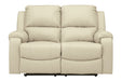 Rackingburg Cream Reclining Loveseat - Lara Furniture